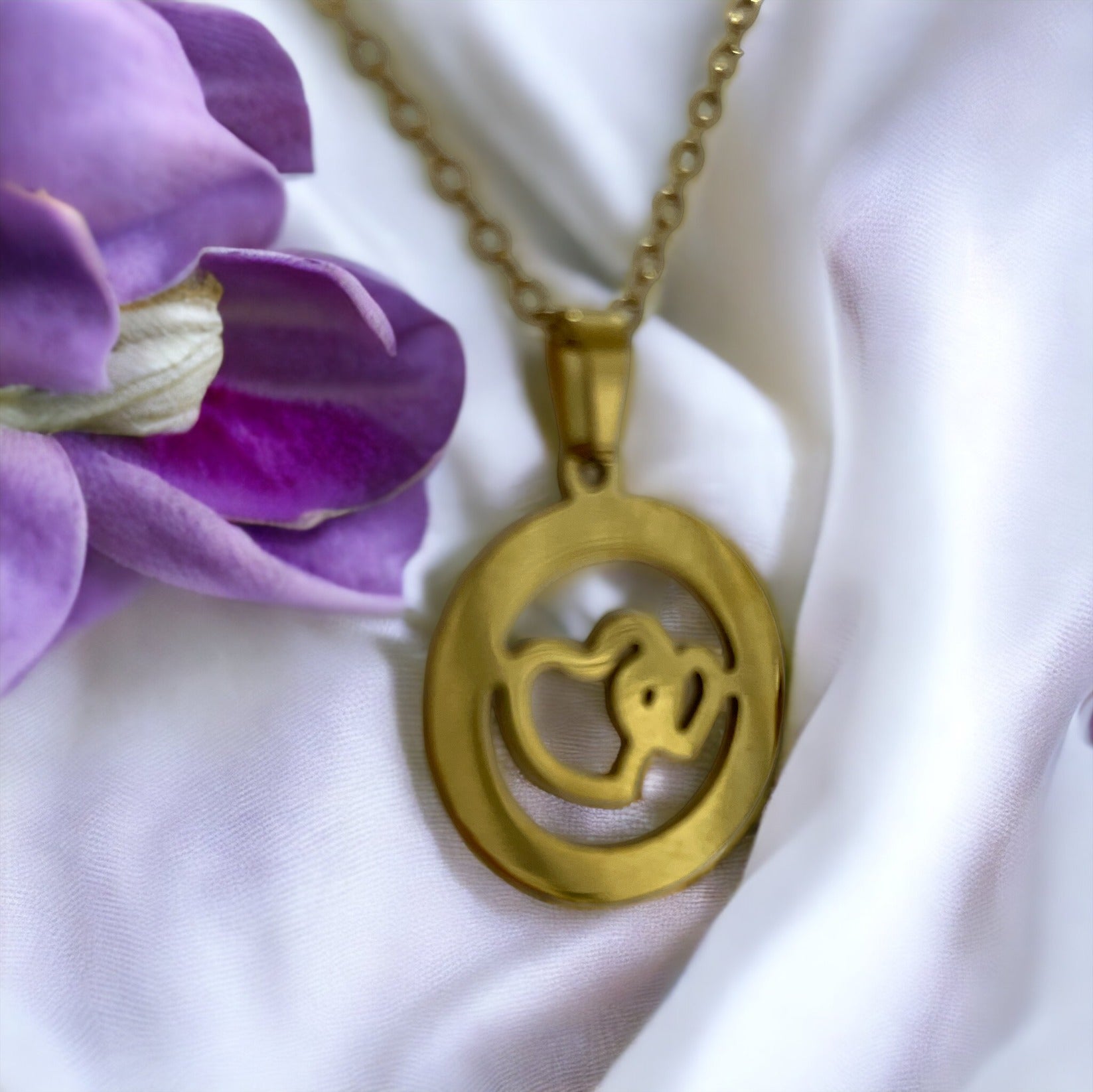 Material: High-quality stainless steel base for lasting wear. Plating: Lustrous gold plating for a gleaming finish. Design: A delicate heart silhouette featuring an intricate, nature-inspired cutout. Chain: Complemented by a classic gold-plated chain that completes the look with elegance. Versatility: The perfect accessory for both casual and formal attire.