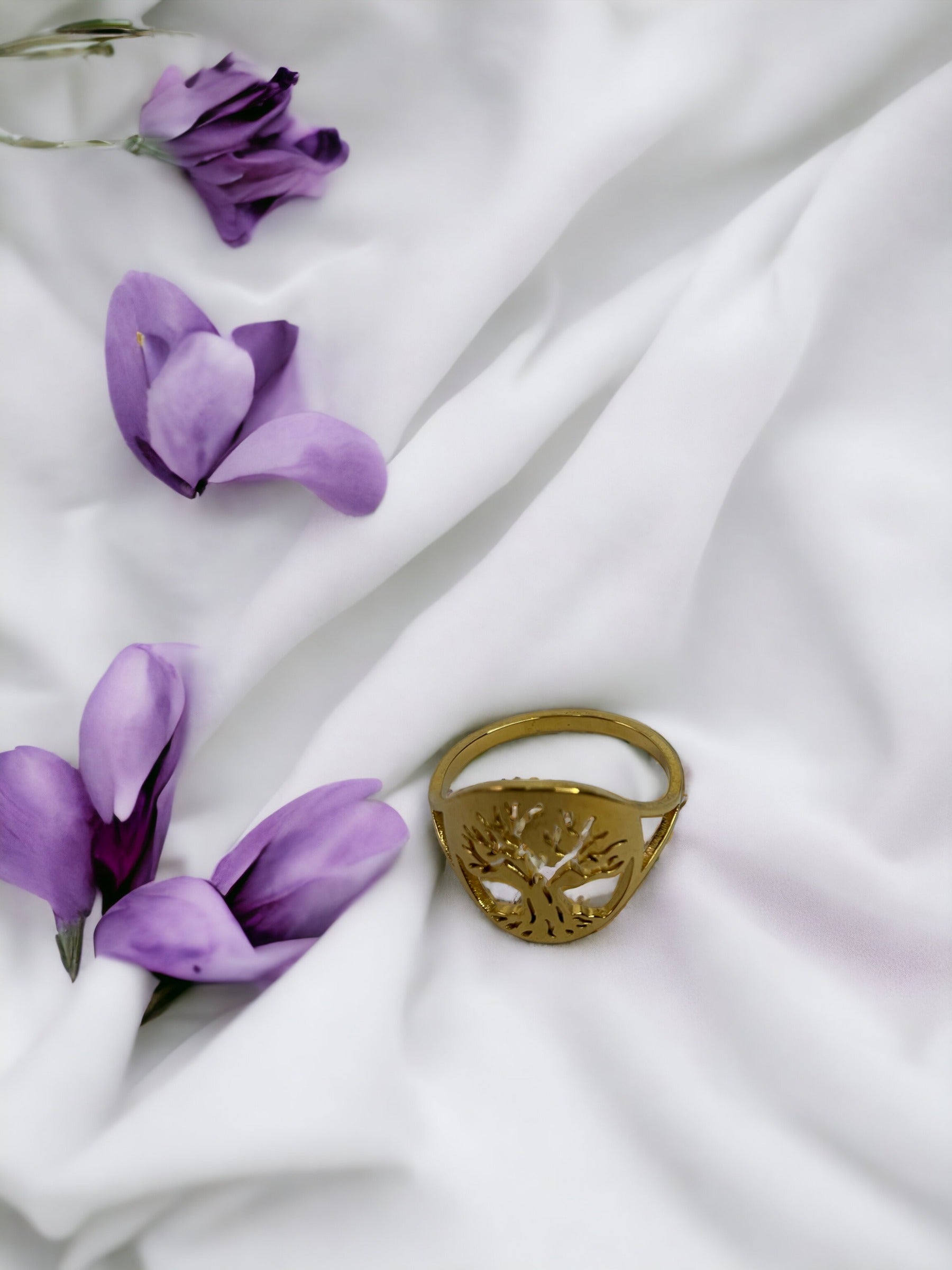Material: Crafted from high-quality stainless steel for durability and longevity. Plating: Radiant gold plating offers a luxurious and sophisticated sheen. Design: The tree of life symbol is delicately cut out to capture the beauty of its sprawling branches and rooted connection. Fit: Smooth interior for a comfortable fit, suitable for daily wear. Versatility: Elegant for special occasions yet simple enough for everyday wear. Sizes: Available in multiple sizes to ensure a perfect fit for everyone.