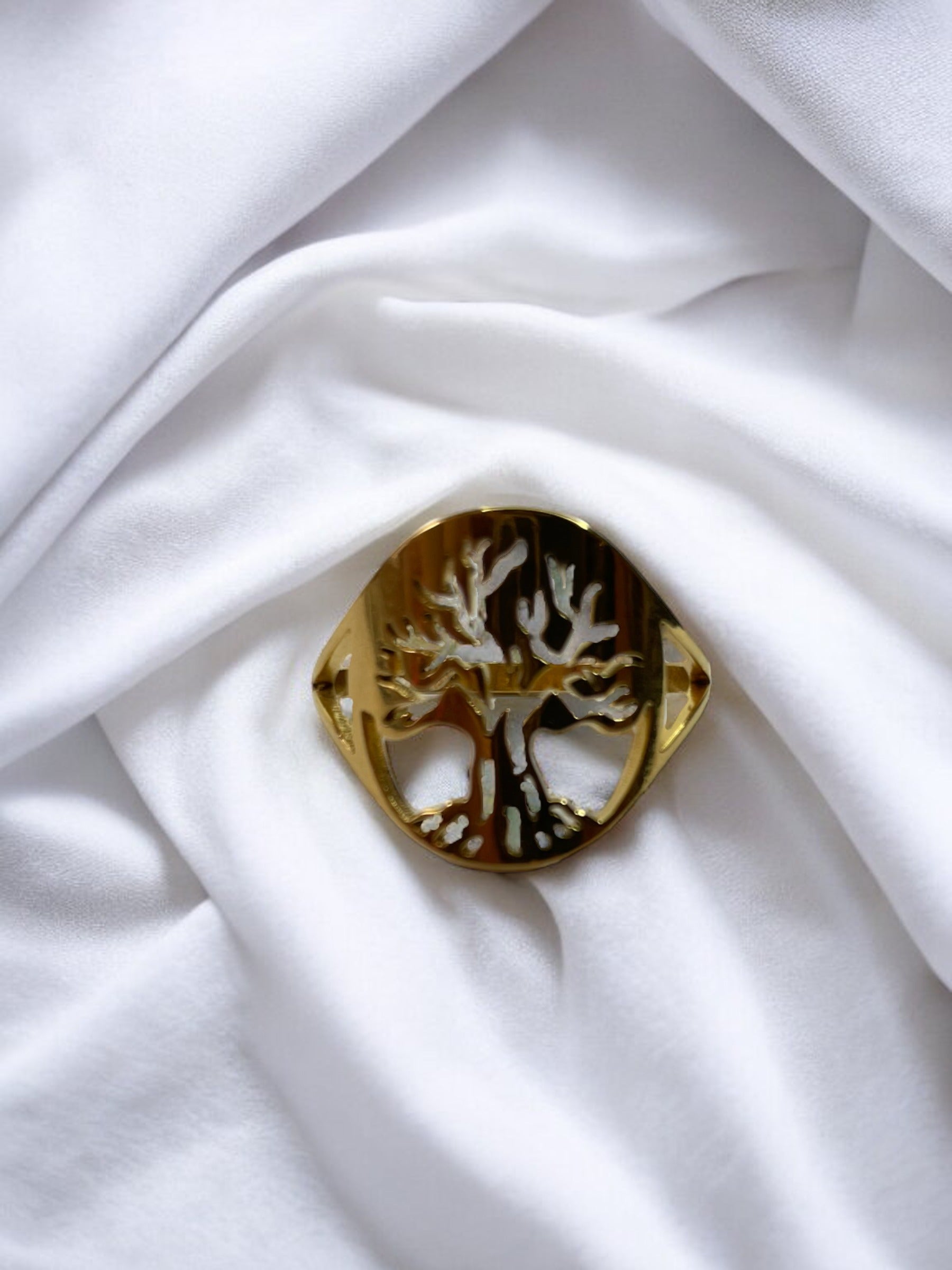 Material: Crafted from high-quality stainless steel for durability and longevity. Plating: Radiant gold plating offers a luxurious and sophisticated sheen. Design: The tree of life symbol is delicately cut out to capture the beauty of its sprawling branches and rooted connection. Fit: Smooth interior for a comfortable fit, suitable for daily wear. Versatility: Elegant for special occasions yet simple enough for everyday wear. Sizes: Available in multiple sizes to ensure a perfect fit for everyone.