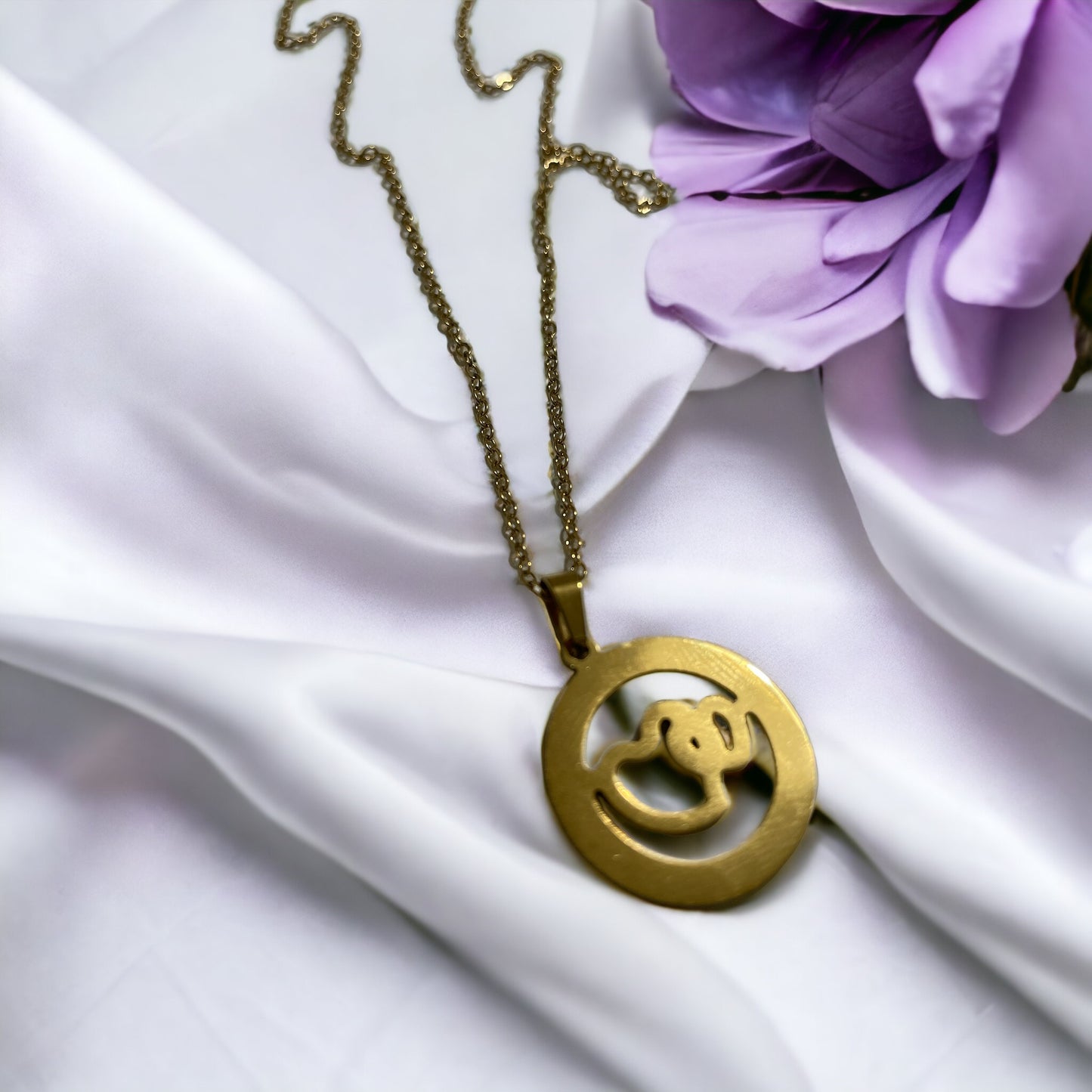 Material: High-quality stainless steel base for lasting wear. Plating: Lustrous gold plating for a gleaming finish. Design: A delicate heart silhouette featuring an intricate, nature-inspired cutout. Chain: Complemented by a classic gold-plated chain that completes the look with elegance. Versatility: The perfect accessory for both casual and formal attire.