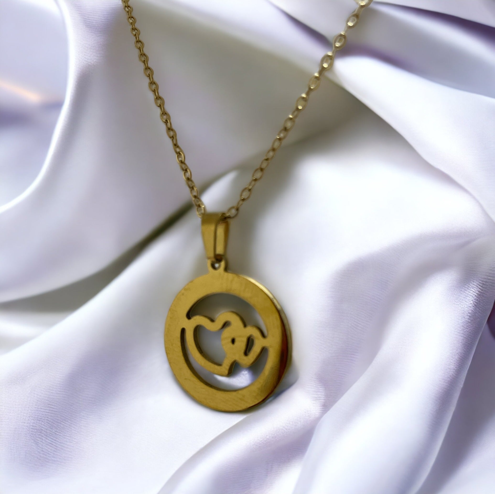 Material: High-quality stainless steel base for lasting wear. Plating: Lustrous gold plating for a gleaming finish. Design: A delicate heart silhouette featuring an intricate, nature-inspired cutout. Chain: Complemented by a classic gold-plated chain that completes the look with elegance. Versatility: The perfect accessory for both casual and formal attire.