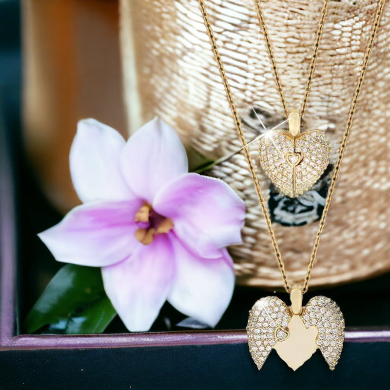 This enchanting piece captures the essence of togetherness, with two sets of footprints intertwined to form a heart, symbolizing the precious steps taken together by loved ones.  Available in both the timeless elegance of stainless steel and the warm glow of gold plating, this necklace is a versatile accessory that adds a touch of grace to any outfit. The heart at the center is a gentle reminder of the love that guides us and the shared experiences that shape our bonds.