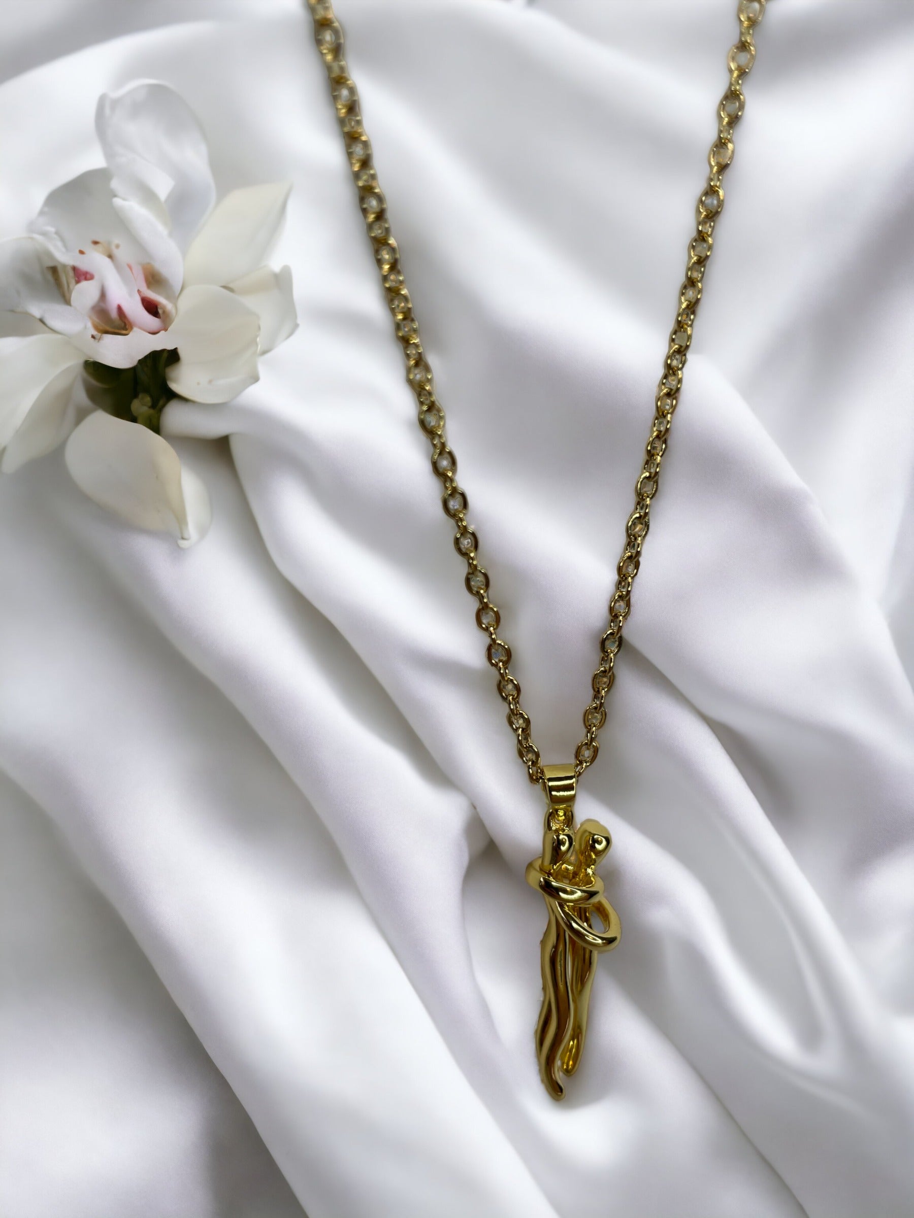 Add a playful charm to your jewelry collection with our  Pendant Necklace. Crafted from stainless steel with a lustrous gold finish, this necklace features a whimsical cat figure pendant. The design captures the feline's curious and graceful nature, with a curled tail that adds a touch of whimsy. 