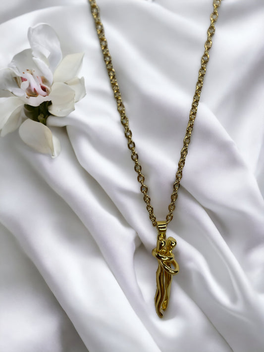 Add a playful charm to your jewelry collection with our  Pendant Necklace. Crafted from stainless steel with a lustrous gold finish, this necklace features a whimsical cat figure pendant. The design captures the feline's curious and graceful nature, with a curled tail that adds a touch of whimsy. 