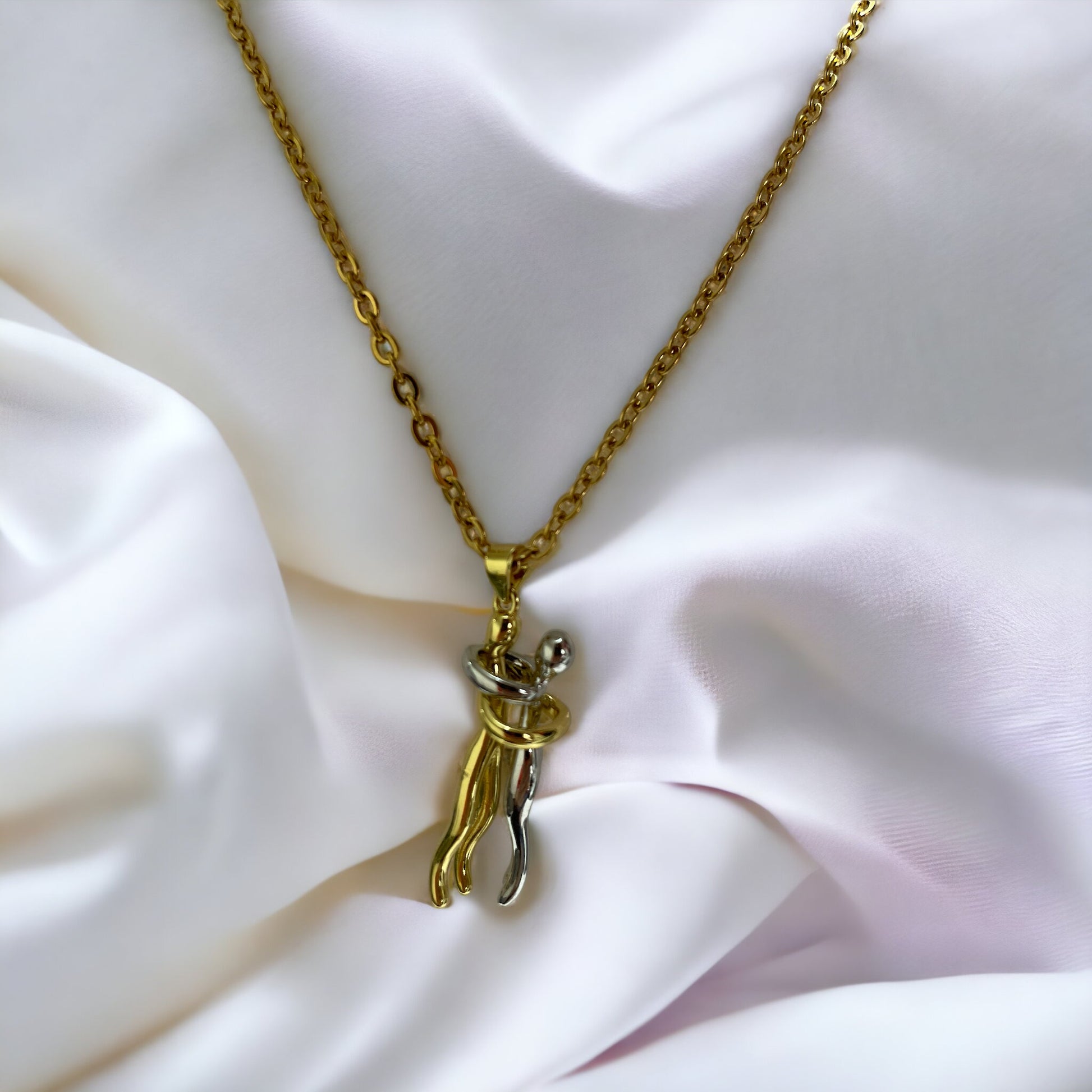 Add a playful charm to your jewelry collection with our Pendant Necklace. Crafted from stainless steel with a lustrous gold finish, this necklace features a whimsical cat figure pendant. The design captures the feline's curious and graceful nature, with a curled tail that adds a touch of whimsy.