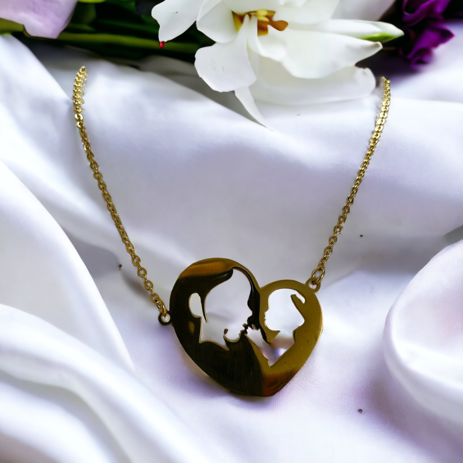 Embrace the elegance of simplicity with our Harmony Heart Necklace. Crafted with precision, this piece captures the essence of affection and togetherness with its interlocking profile design nestled within a heart's silhouette.