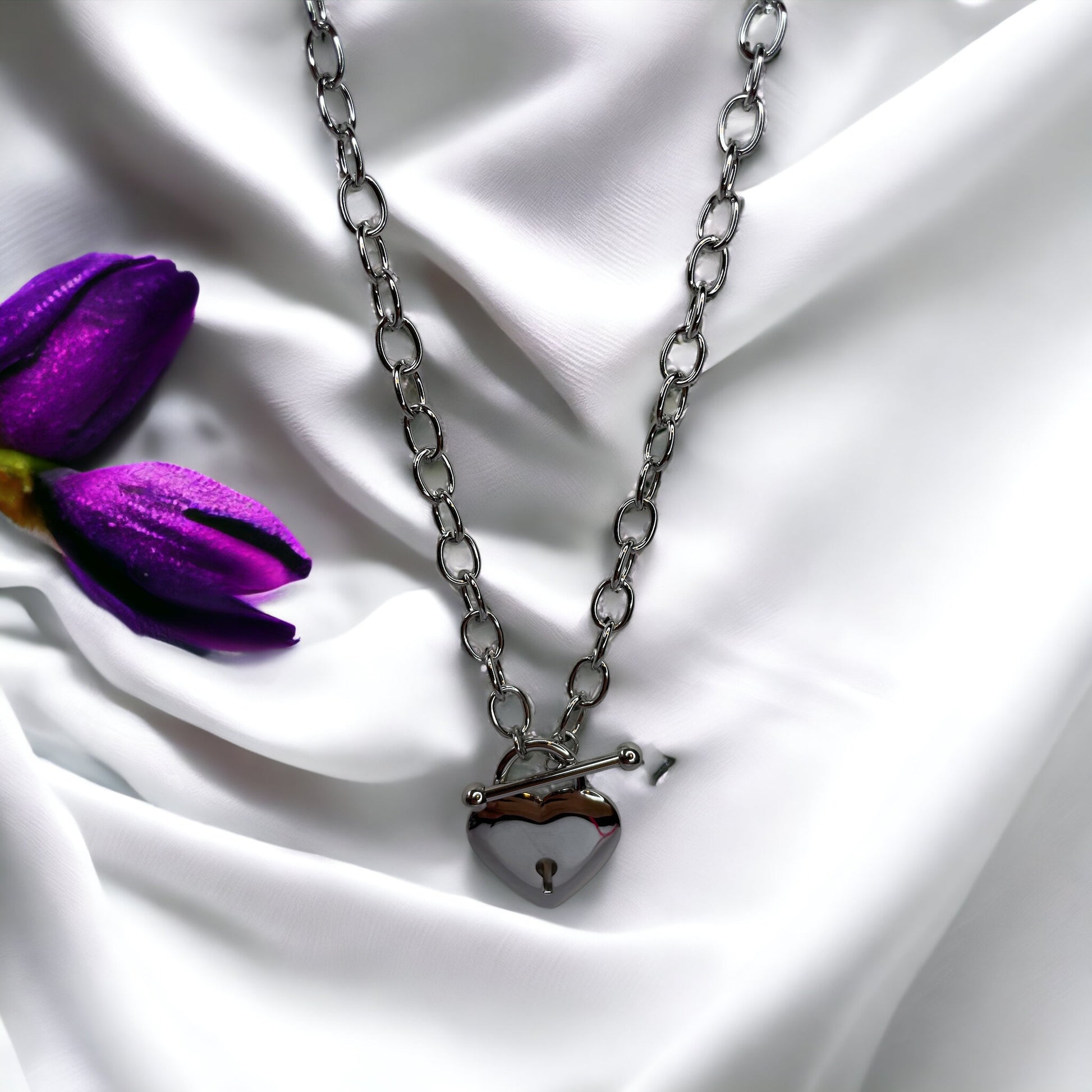 Unveil the Locket of  Love Necklace, a masterpiece that combines contemporary style with a nostalgic touch. Crafted from durable stainless steel with an elegant gold plated finish, this necklace features a unique heart-shaped locket pendant. 