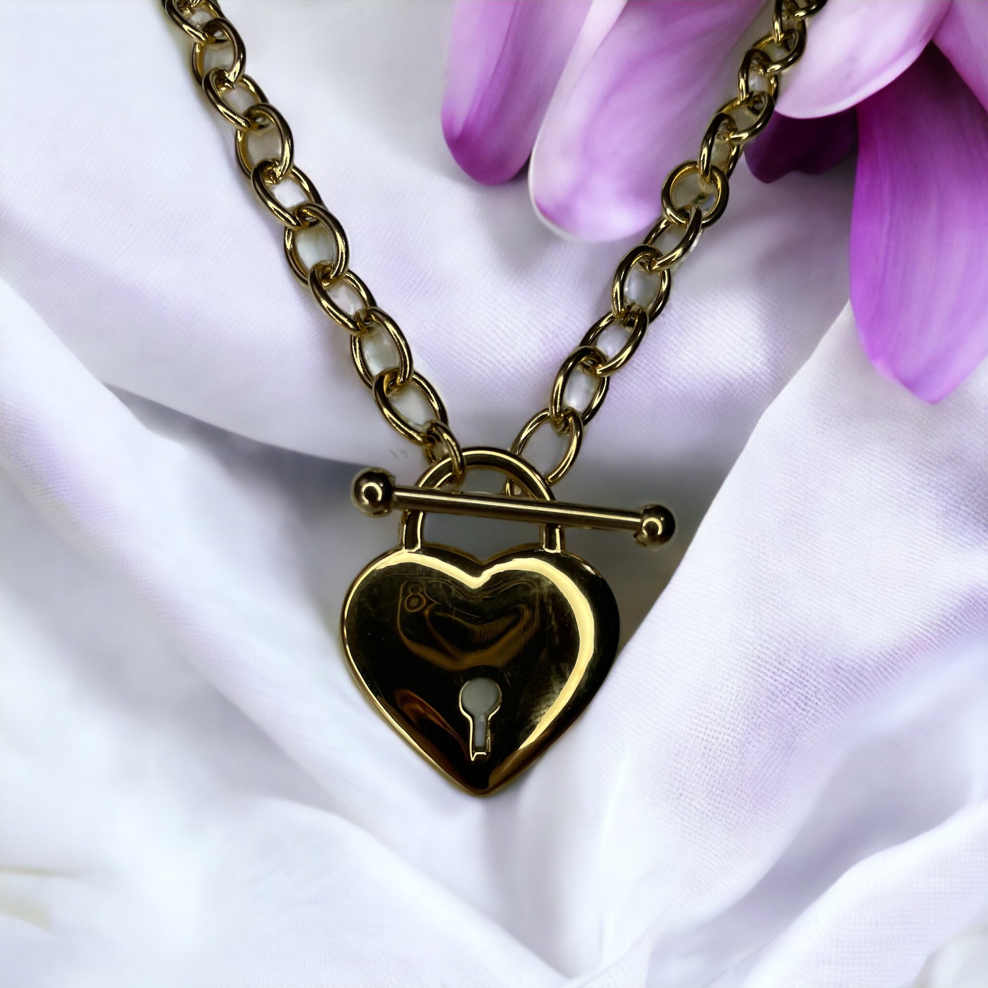 Unveil the Locket of  Love Necklace, a masterpiece that combines contemporary style with a nostalgic touch. Crafted from durable stainless steel with an elegant gold plated finish, this necklace features a unique heart-shaped locket pendant. 
