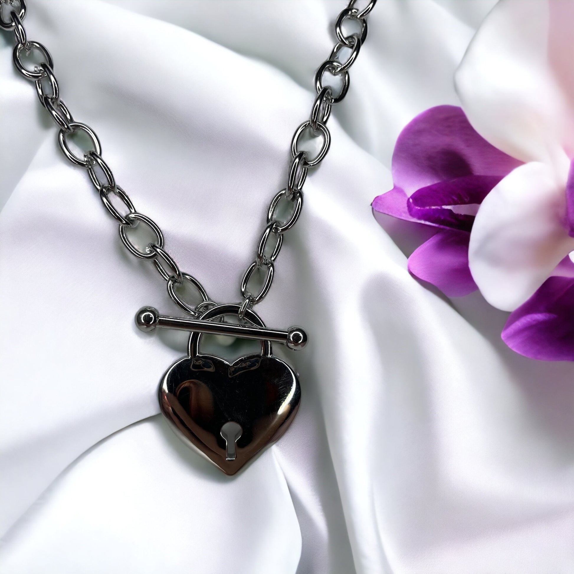Unveil the Locket of Love Necklace, a masterpiece that combines contemporary style with a nostalgic touch. Crafted from durable stainless steel with an elegant gold plated finish, this necklace features a unique heart-shaped locket pendant. 