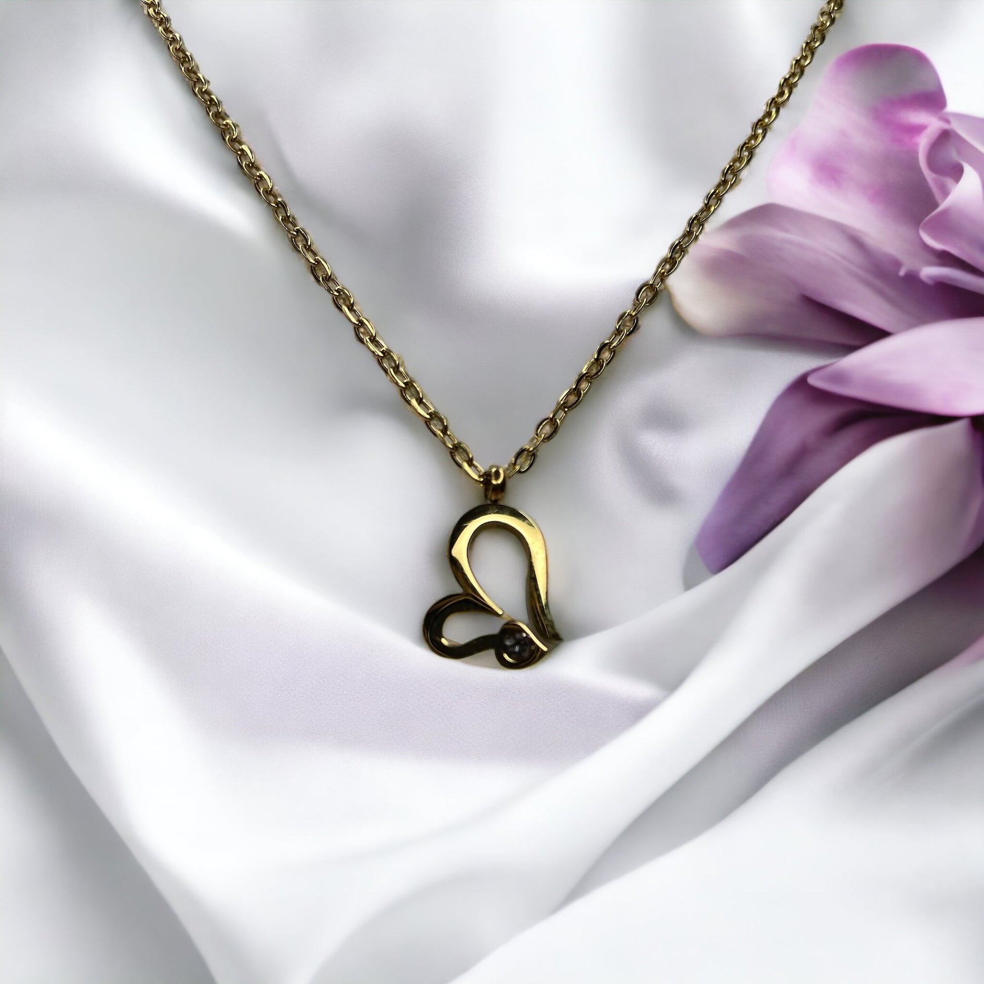 Celebrate eternal love with our Sleek Heart and Infinity Necklace. This delicate piece combines the classic heart and the infinity symbol, both crafted from high-quality stainless steel with a polished gold finish. The design showcases a heart, seamlessly intertwined with an infinity sign, embodying everlasting love and endless possibility.