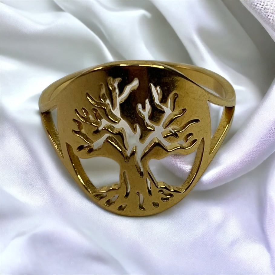 Material: Crafted from high-quality stainless steel for durability and longevity. Plating: Radiant gold plating offers a luxurious and sophisticated sheen. Design: The tree of life symbol is delicately cut out to capture the beauty of its sprawling branches and rooted connection. Fit: Smooth interior for a comfortable fit, suitable for daily wear. Versatility: Elegant for special occasions yet simple enough for everyday wear. Sizes: Available in multiple sizes to ensure a perfect fit for everyone.