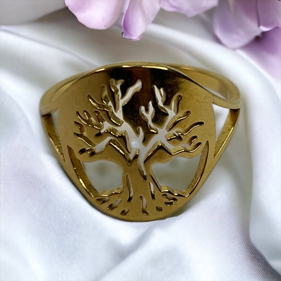 Material: Crafted from high-quality stainless steel for durability and longevity. Plating: Radiant gold plating offers a luxurious and sophisticated sheen. Design: The tree of life symbol is delicately cut out to capture the beauty of its sprawling branches and rooted connection. Fit: Smooth interior for a comfortable fit, suitable for daily wear. Versatility: Elegant for special occasions yet simple enough for everyday wear. Sizes: Available in multiple sizes to ensure a perfect fit for everyone.