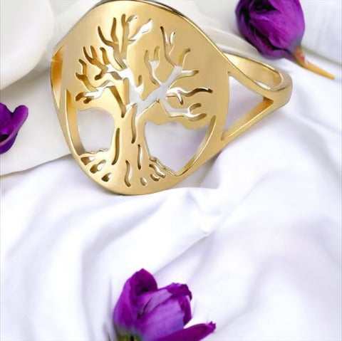 Material: Crafted from high-quality stainless steel for durability and longevity. Plating: Radiant gold plating offers a luxurious and sophisticated sheen. Design: The tree of life symbol is delicately cut out to capture the beauty of its sprawling branches and rooted connection. Fit: Smooth interior for a comfortable fit, suitable for daily wear. Versatility: Elegant for special occasions yet simple enough for everyday wear. Sizes: Available in multiple sizes to ensure a perfect fit for everyone.
